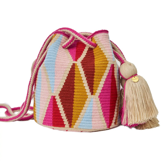 Handcrafted beige & pink Wayuu crochet bag made by indigenous artisans in Colombia