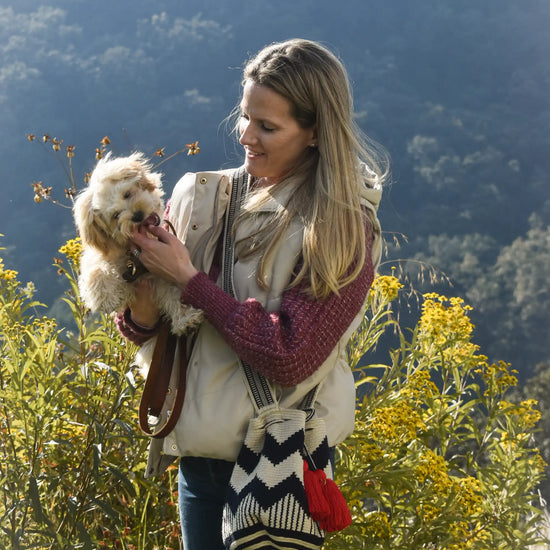 Lifestyle photo of medium beige, blue and red Wayuu bags, handmade in Colombia