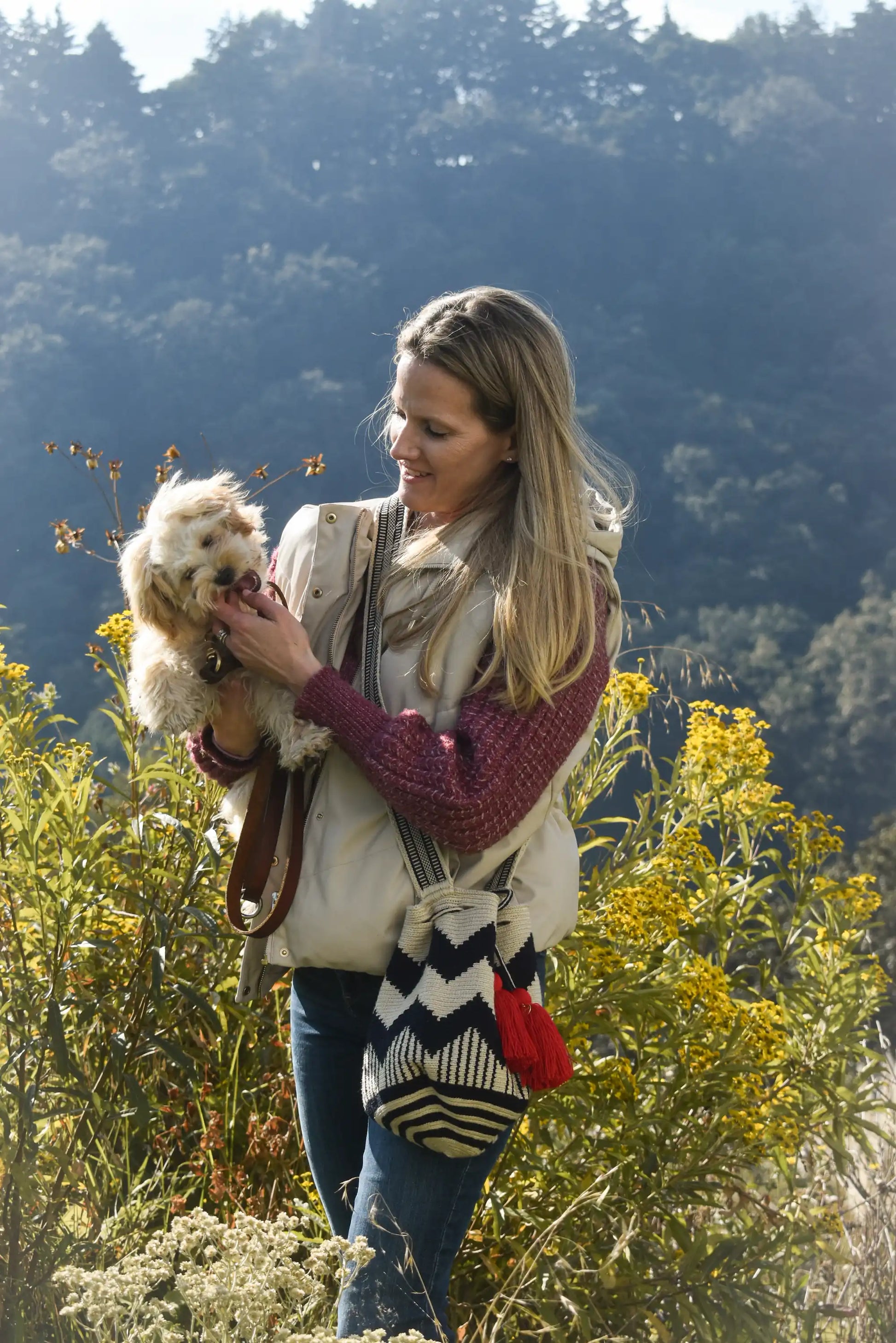 Lifestyle photo of medium beige, blue and red Wayuu bags, handmade in Colombia