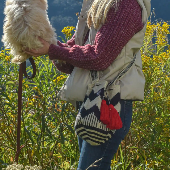 Lifestyle photo of medium beige, blue and red Wayuu bags, handmade in Colombia