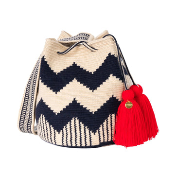 Handcrafted beige, azul & rojo  striped Wayuu crochet bag made by indigenous artisans in Colombia