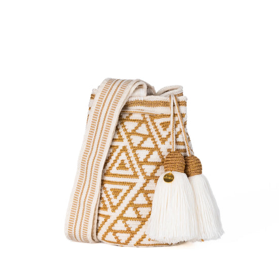 White and gold geometric Wayuu bag, handmade by indigenous artisans in Colombia