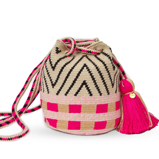 Handcrafted pink & black Wayuu crochet bag made by indigenous artisans in Colombia