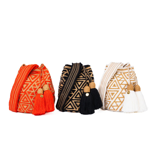 Small geometric Wayuu bags handmade by indigenous artisans in Colombia.