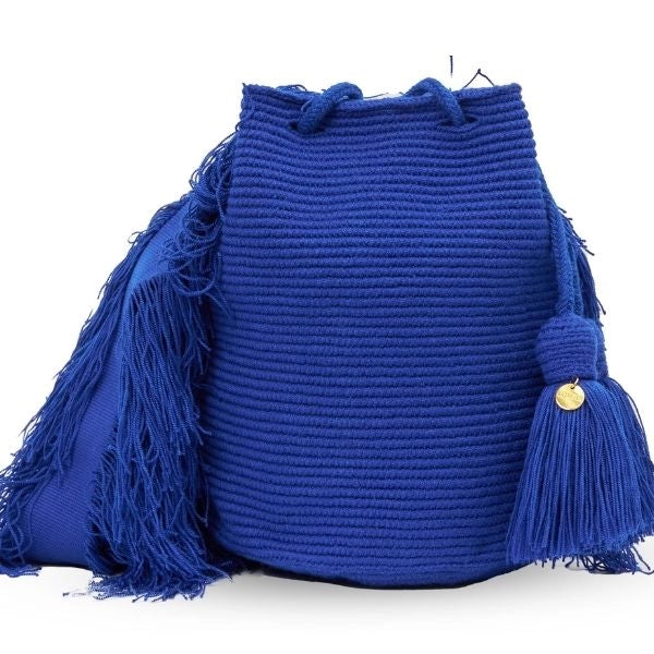 Wayuu crochet bag in blue, handmade by indigenous artisans in Colombia.