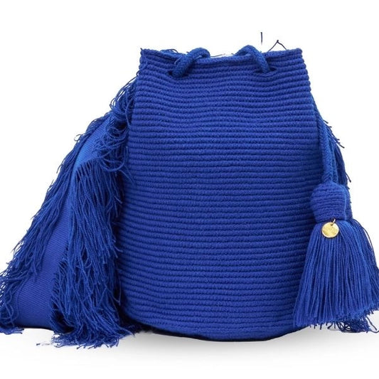 Wayuu crochet bag in blue, handmade by indigenous artisans in Colombia.