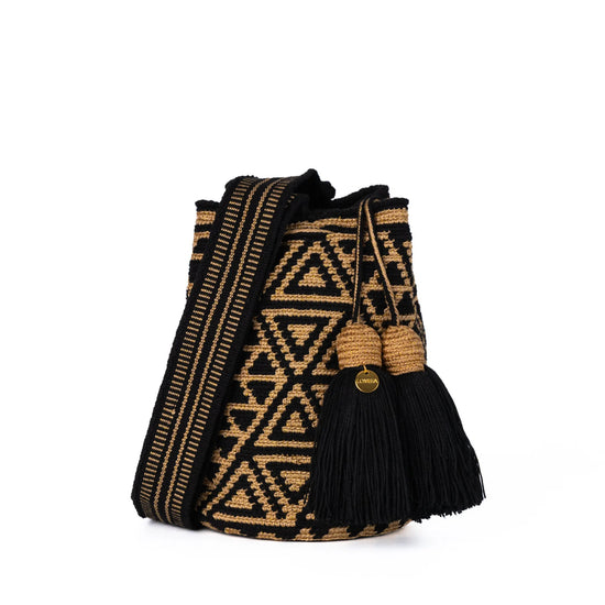 Black and gold geometric Wayuu bag, handmade by indigenous artisans in Colombia.