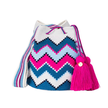 Handcrafted blue, black, pink and white striped Wayuu crochet bag made by indigenous artisans in Colombia