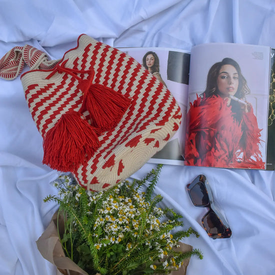 Handcrafted red beige stripes Wayuu crochet bag made by indigenous artisans in Colombia