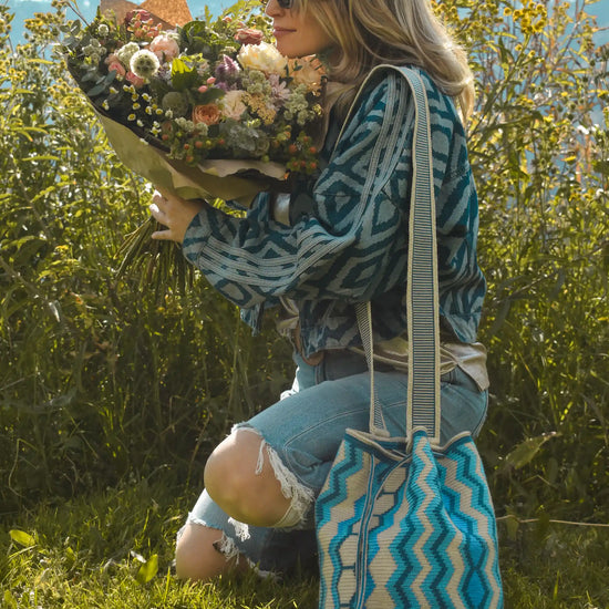 Nishu large Wayuu crochet bag in blue and beige stripes, handcrafted by Colombian artisans