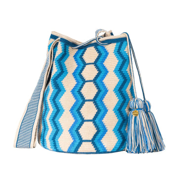 Handcrafted blue & beige striped Wayuu crochet bag made by indigenous artisans in Colombia