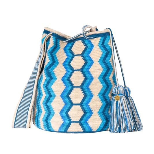 Handcrafted blue & beige striped Wayuu crochet bag made by indigenous artisans in Colombia