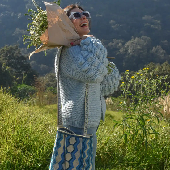 Nishu large Wayuu crochet bag in blue and beige stripes, handcrafted by Colombian artisans