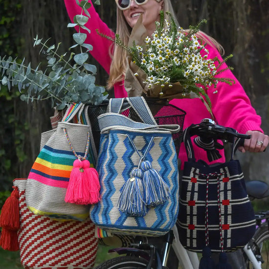 Lifestyle photo of large colors Wayuu bags, handmade in Colombia