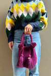 Magenda crochet bag with pom-poms and tassels, made in Colombia by Wayuu artisans