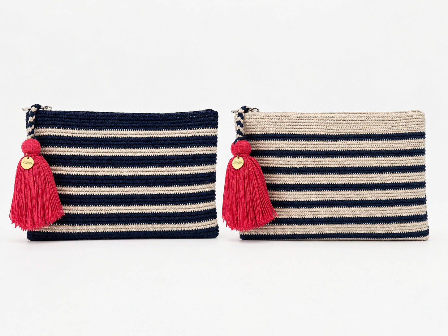Two woven zip pouches with red & pink tassels, shown side by side on a white background. The left pouch is navy blue & has cream horizontal stripes, and the right pouch is beige and has navy horizontal stripes.